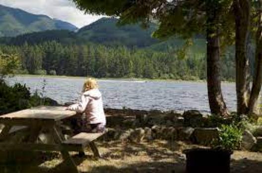 camper sitting at picnic table