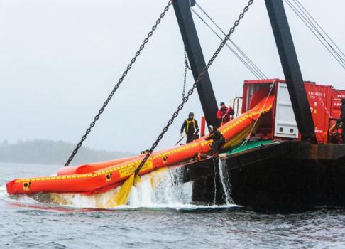 blow up boat being put on regular boat