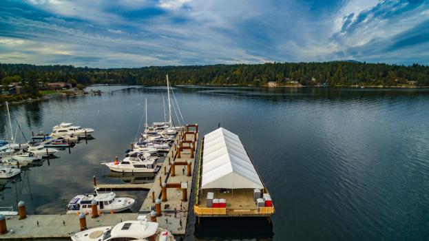 big tent covering an area at a marina